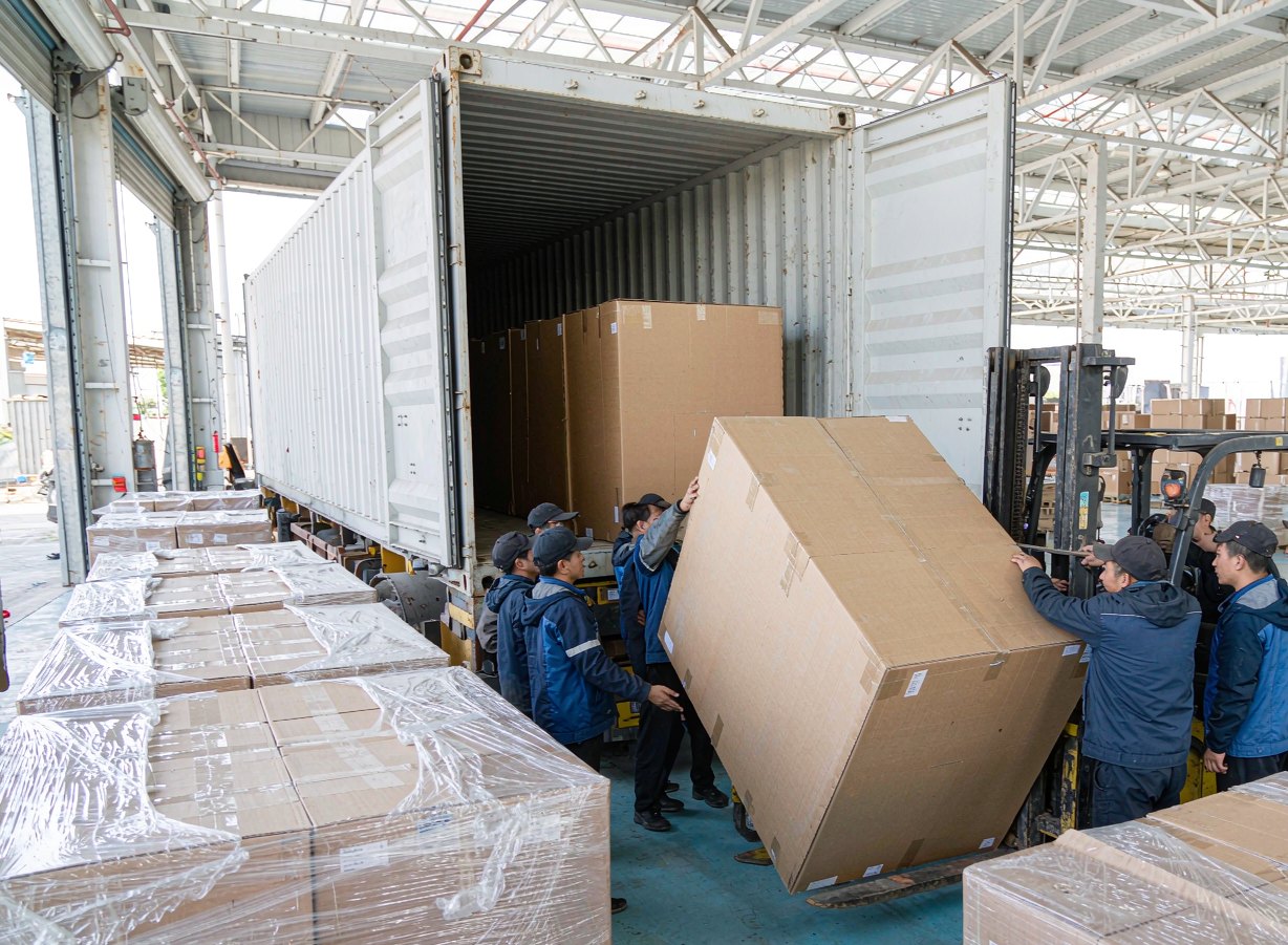 Furniture cartons being loaded into a 40-foot high cube container at our loading dock