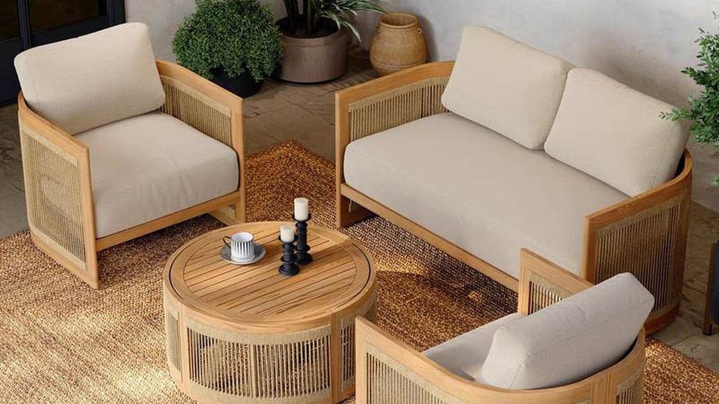Teak and rope woven outdoor sofa set on a warm villa terrace